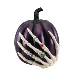 DECORATION CITROUILLE EN POLYRESINE VIOLETTE AVEC MAIN DE SQUELETTE
