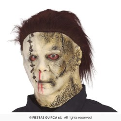 MASQUE LATEX AVEC CHEVEUX ASSASSIN CUIR ET TRONCONNEUSE