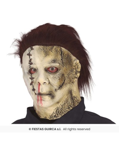 MASQUE LATEX AVEC CHEVEUX ASSASSIN CUIR ET TRONCONNEUSE